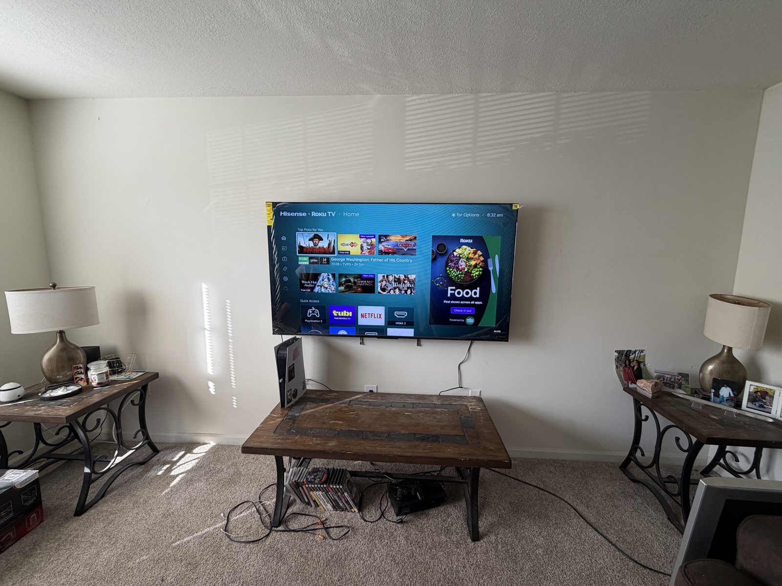Wall-mounted flat screen television in a living room after professional TV mounting