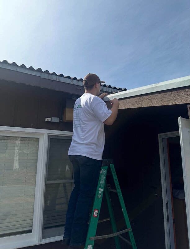 Davis — technician at Zaxx Tech Solutions — on a camera install job