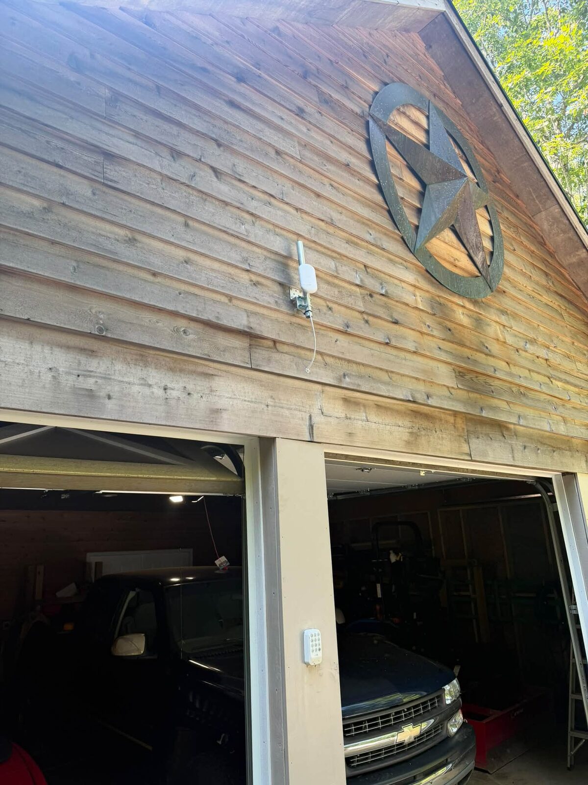 Point-to-point wireless antenna mounted on a detached garage