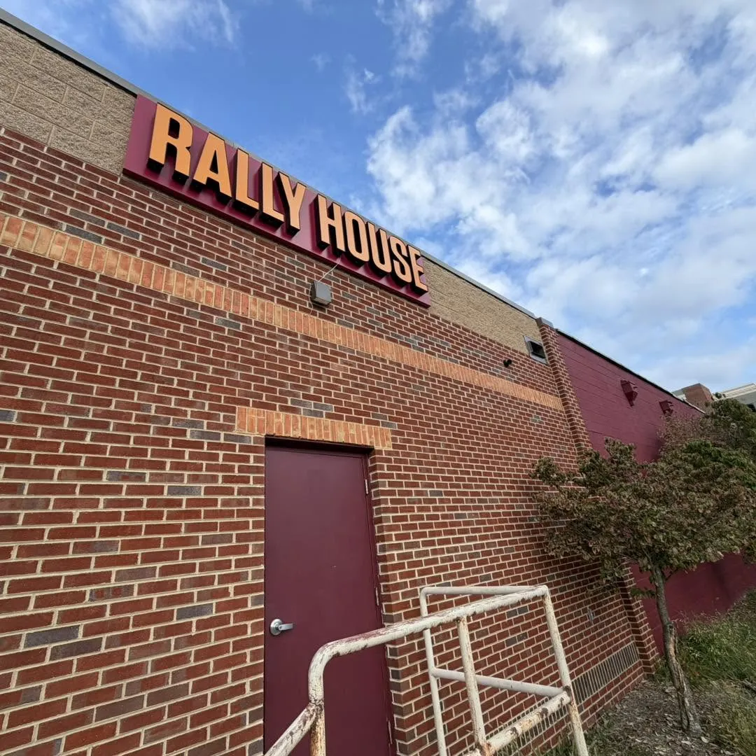 Rally House commercial surveillance camera installation by Zaxx Tech Solutions on a brick retail building