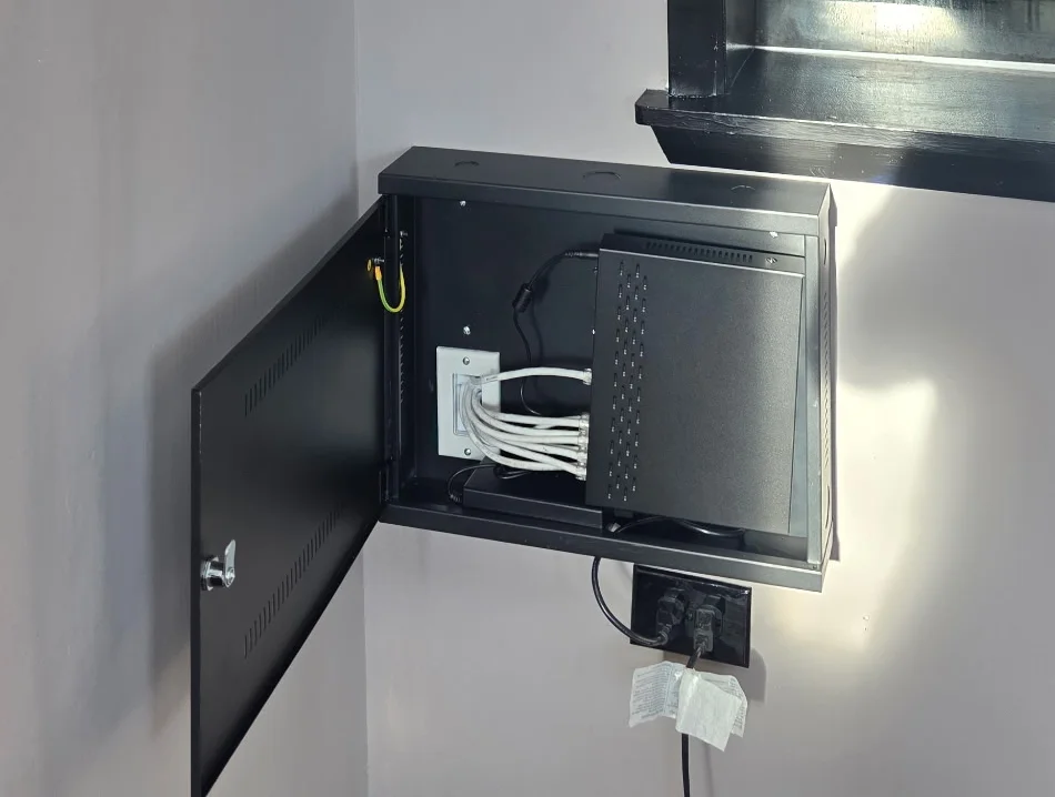 NVR enclosure with Cat6 security camera cabling installed by Zaxx Tech Solutions at Redline Tire & Lube