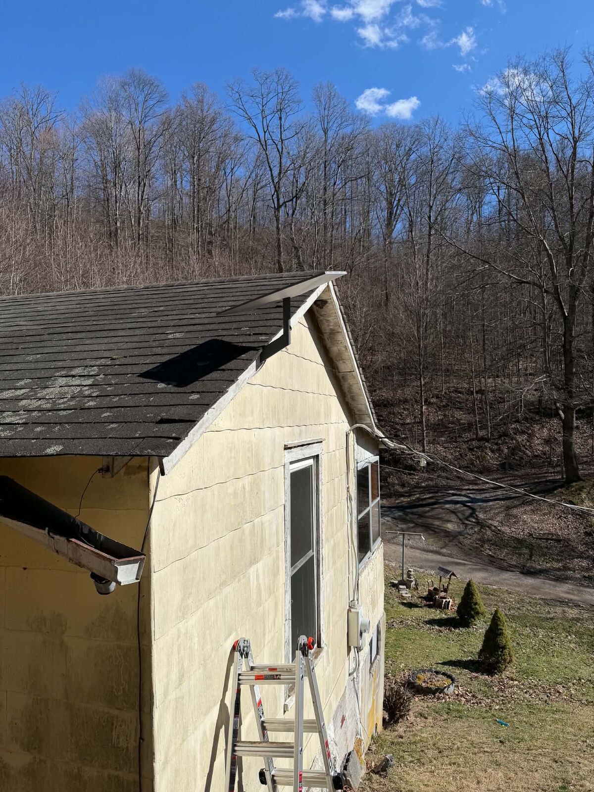 Starlink roof mount installation in progress — ladder and building