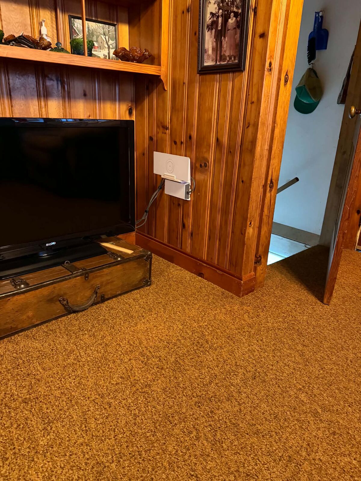 Starlink indoor router mounted on wall in living room